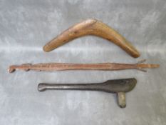 A TRIBAL ART AUSTRALIAN ABORIGINAL WOODEN CLUB, with inset stone axe head, a wooden boomerang and