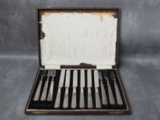 A CASED SET OF SIX ART DECO HALLMARKED SILVER HANDLED DESSERT KNIVES AND FORKS, circa. 1932