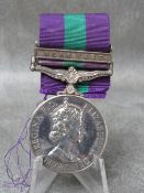 A GENERAL SERVICE MEDAL WITH NEAR EAST BAR, awarded to Corporal T.W. Toon R.A.P.C