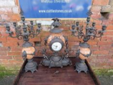 A CONTINENTAL MARBLE CLOCK GARNITURE, the clock with Franz Hermle movement, having a white enamel