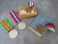 A SET OF FOUR R.A.F. MEDALS FOR C.H. CARNWELL, together with his R.A.F. bible