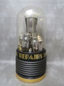 A TALL GLASS DOMED ILLUMINATED COUNTER DISPLAY FOR 'YOUR RADIO REPAIRS HERE', the glass dome