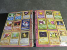 HARDCASE POKEMON FOLDER AND CONTENTS, to include base set, jungle and fossil cards, approximately
