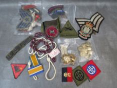 A LARGE COLLECTION OF VARIOUS MILITARY PATCHES, together with various stripes and buttons etc.