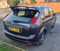 A 2007 GREY FORD FOCUS GHIA T 'BF57 YXZ', 1.6L petrol, approximate milage 81,900, has ST coupe seats