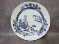 A 19TH CENTURY ORIENTAL BLUE AND WHITE CIRCULAR CHARGER, decorated with typical pagoda and landscape