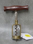 A 19TH CENTURY BRASS CORKSCREW, with wooden handle, L 12 cm