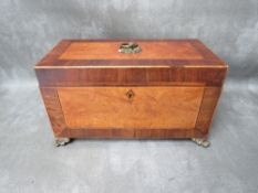 A 19TH CENTURY INLAID TEA CADDY, of rectangular outline, the hinged lid opening to a part fitted