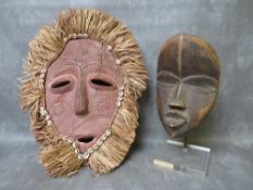 A WEST AFRICAN DAN TRIBE LIBERIA MASK, with professional museum style mount together with a Congo