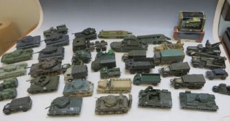 FORTY UNBOXED MILITARY VEHICLES MAINLY BY SOLIDO, to include tanks, half tracks, boat, wagons, etc.,