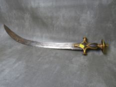 AN INDIAN TULWAR SWORD, with curved blade and iron grip, with gilded patterned borders and disc