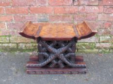 A 20TH CENTURY CARVED TRIBAL WOODEN STOOL, H 41 cm, W 56 cm