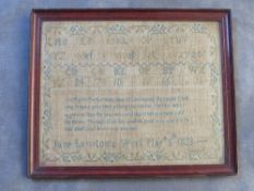 A 19TH CENTURY SAMPLER BY JANE LAWTON MARCH 5TH 1823, framed and glazed, 25 x 32 cm