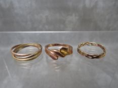 A HALLMARKED 9CT ROSE GOLD DRESS RING, together with a three colour crossover 9ct gold band and a