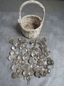 A LARGE QUANTITIY OF MOSTLY 19TH CENTURY GLASS DECANTER STOPPERS, contained in a wicker basket