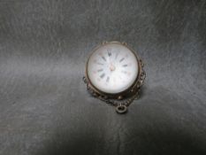 A MINIATURE BULLSEYE GLASS POCKET WATCH, with cased movement of globular form, Dia. 3 cm