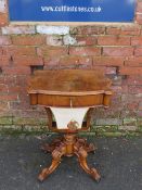 A VICTORIAN WALNUT WORK TABLE, having a single drawer with pull-out compartment below, raised on