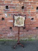 A 19TH CENTURY MAHOGANY POLE SCREEN, the framed needlepoint panel supported on a barleytwist