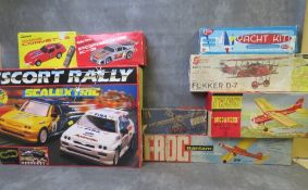 A MIXED BOXED TOY LOT, to include Scalextric Ford Escort rally set, two Radio Shack remote control