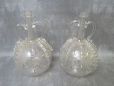 A PAIR OF 18TH CENTURY DUTCH HAND BLOWN GLASS DECANTERS, with applied glass decoration, wheel cut