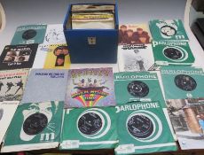 A SINGLES RECORD CASE CONTAINING OVER FIFTY BEATLES AND FORMER BEATLES SINGLE RECORDS, to include