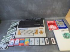 A BOXED SHARP MZ711 PERSONAL COMPUTER, with manual, guides and games, box is A/F