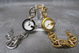 A LADIES DIAMOND SET GUCCI WRISTWATCH IN STAINLESS STEEL, the back of the case stamped Gucci 107 and