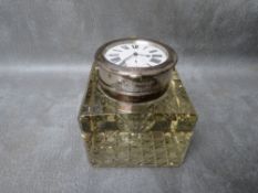 A HEAVY CUT GLASS INKWELL, with hallmarked silver swivel watch lid / cover