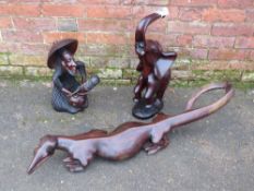 THREE CARVED EASTERN HARDWOOD STATUES / MODELS, to include a rearing elephant (3)