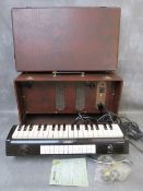 A UNIVOX MODEL J7 MONOPHONIC VALVE ORGAN, complete with lead and user guide
