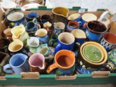 A tray of assorted studio pottery jugs etc
