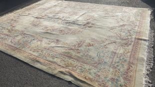 An extra large Oriental Chinese rug, in cream and salmon colourway
