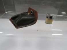 A novelty miniature cigarette lighter with original case