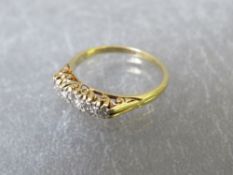 An 18ct gold five stone diamond ring, ring size M½, approximate weight 2.9 g