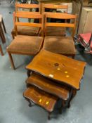 A set of four vintage dining chairs together with an Italian style nest of tables