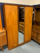 A Meredew teak mirrored wardrobe