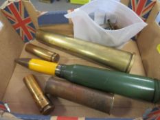 A collection of militaria comprising of small brass shell cases, various calibers of fired blanks, a