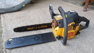 A MAC 436 two stroke chainsaw and a petrol strimmer