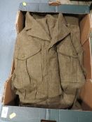 Four items of military uniform comprising 3 x 49 Patt BD blouse size 11 dated 1954 and a pair of