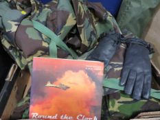 A tray of militaria to include camouflage trousers. gloves etc