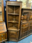 A reproduction oak open corner cabinet