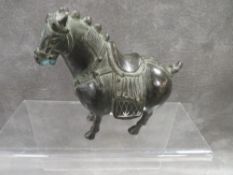An Oriental style small bronze figure of a horse