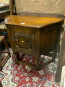 A small oak reproduction creedence style cupboard