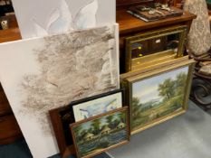 A collection of assorted pictures, prints, and mirrors