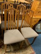 A set of four modern dining chairs