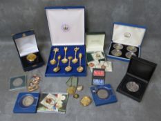 A collection of coin jewellery trinkets, spoons etc to include an 1887 gilt half-crown swivel
