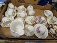 A tray of assorted vintage cups and saucers to include Aynsley