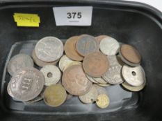 A tub of British and World coins including issues from China, France, Guernsey etc