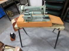 A vintage cased Alpha sewing machine together with a Handy Gram portable record player etc
