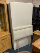 A modern single divan bed base with headboard